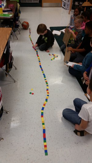 Children playing with colored blocks on the floor. Children playing with colored blocks on the floor.